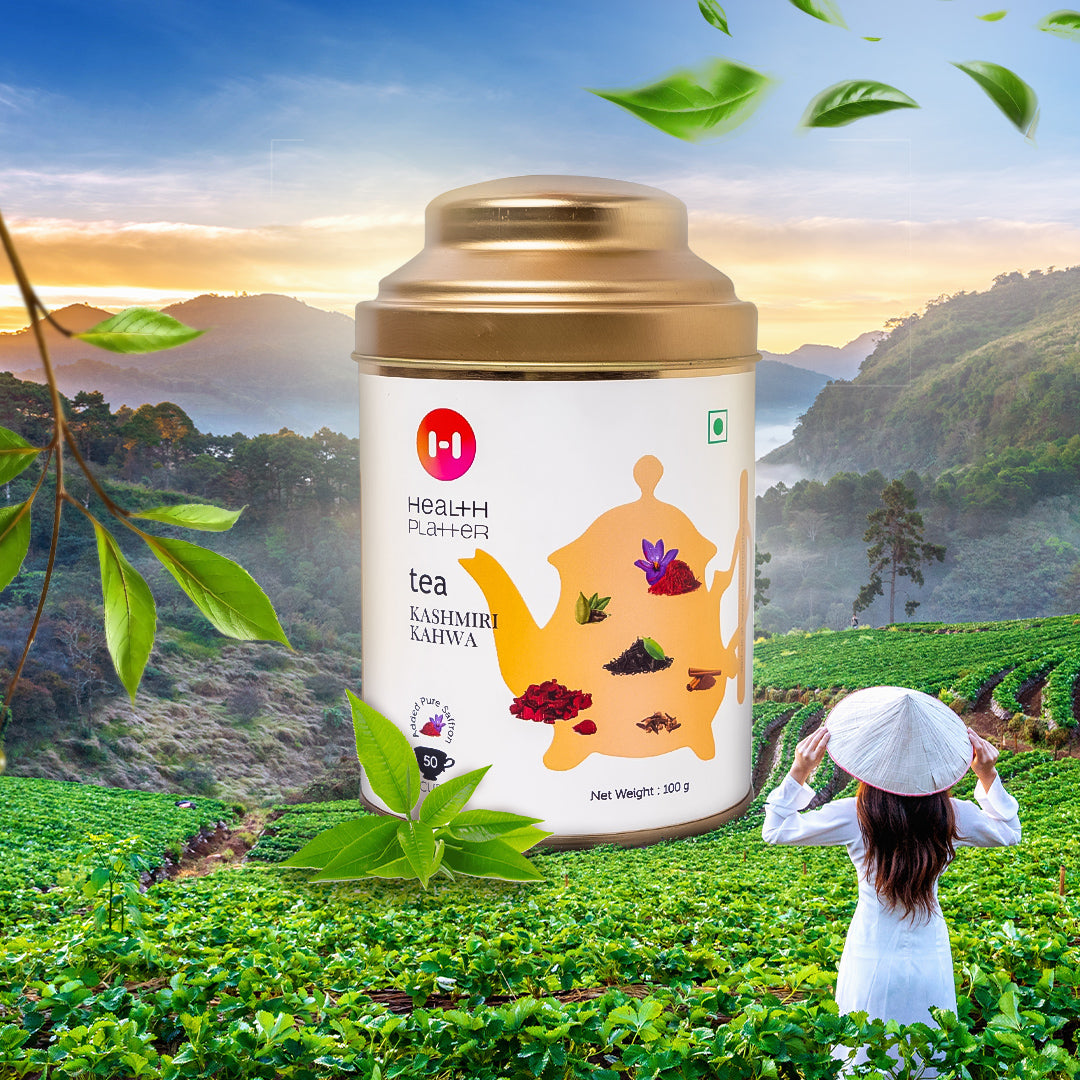 A package of Health Platter Kashmiri Kahwa Tea Wholeleaf Tea with a brass kettle illustration, set against a background of a tea plantation with a mountainous landscape.
